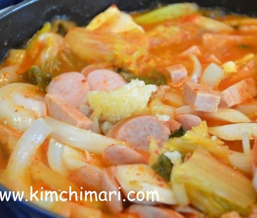 kimchi sausage spam onions boiling in pot