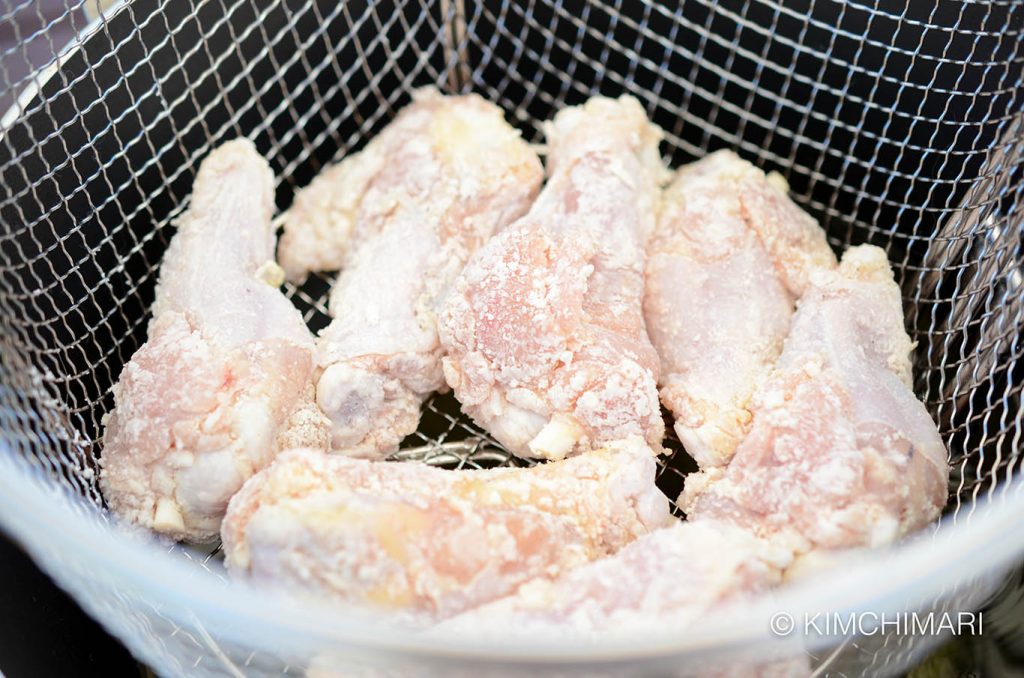 Chicken in basket for frying