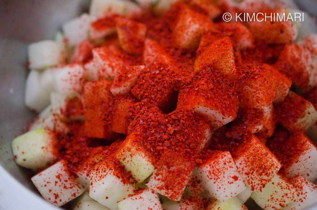 Radish cubes coated in red chili powder - gochukaru