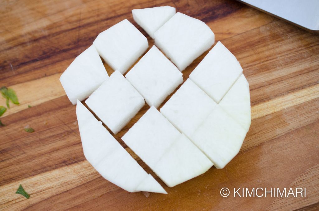 radishes cut into cubes on cutting board