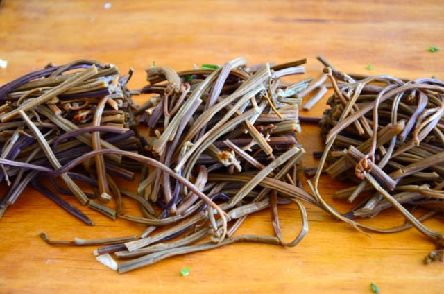 Cut Bracken Fiddleheads on cutting board