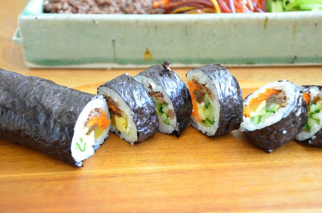 gimbap (kimbap) rolls slices laid out on board