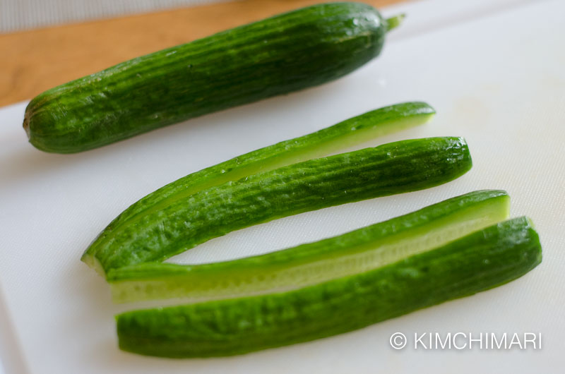 cutting persian cucumbers on cutting board