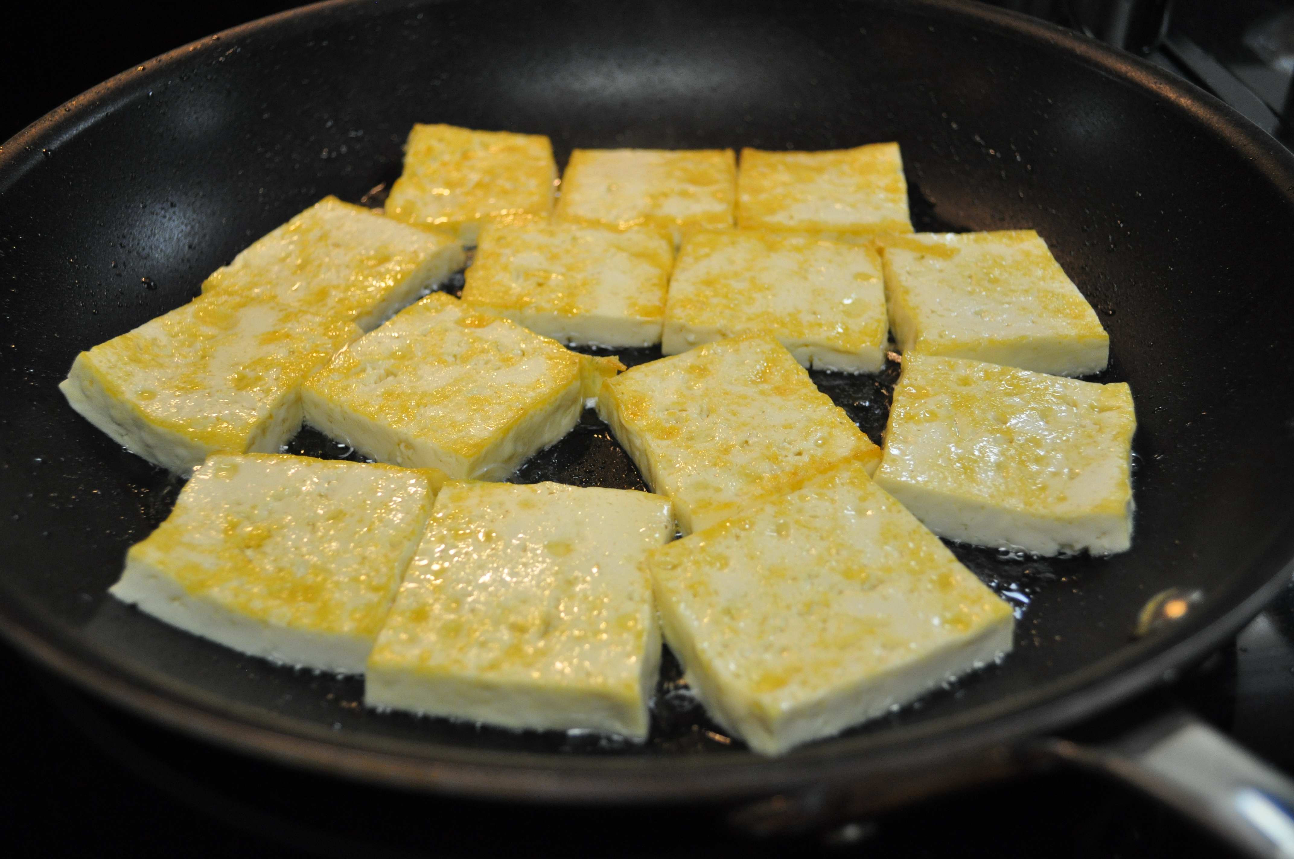 Tofu lightly browned in pan