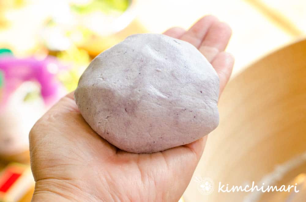 finished purple songpyeon tteok dough ball on my hand