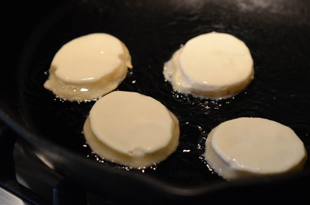 potato fritters or gamjajeon frying in pan