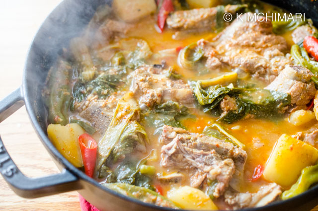 Cooked Gamjatang steaming in shallow pot