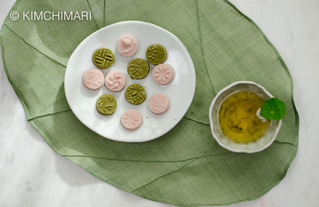 Plate of green tea and omija cookies with a cup of green tea