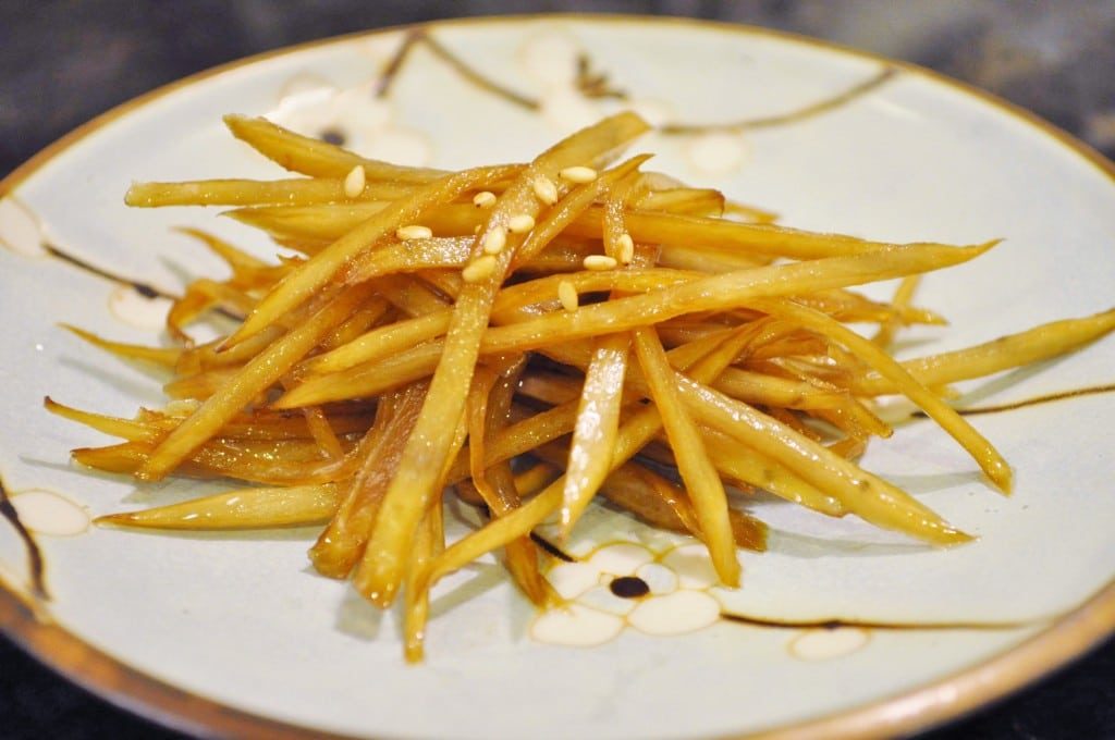 julienned burdock braised in soys sauce on blue plate