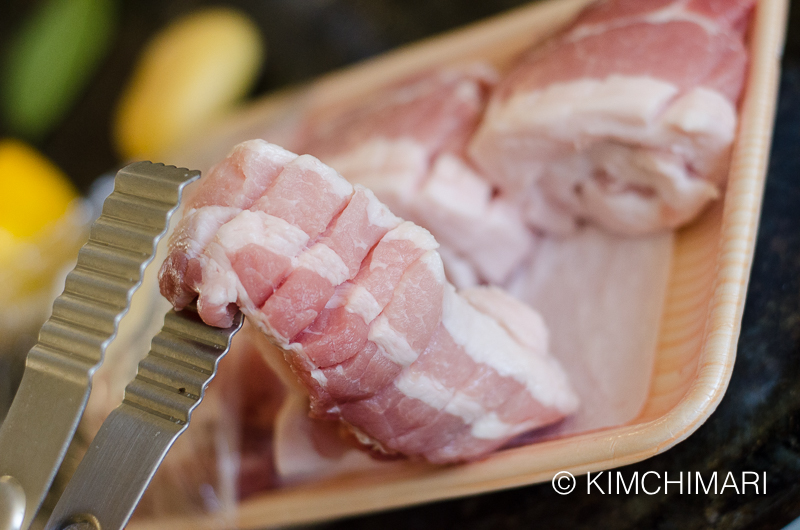 raw pork belly slices scored in package 