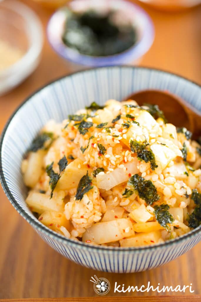 Kimchi Mari Rice in blue striped bowl on wooden tray