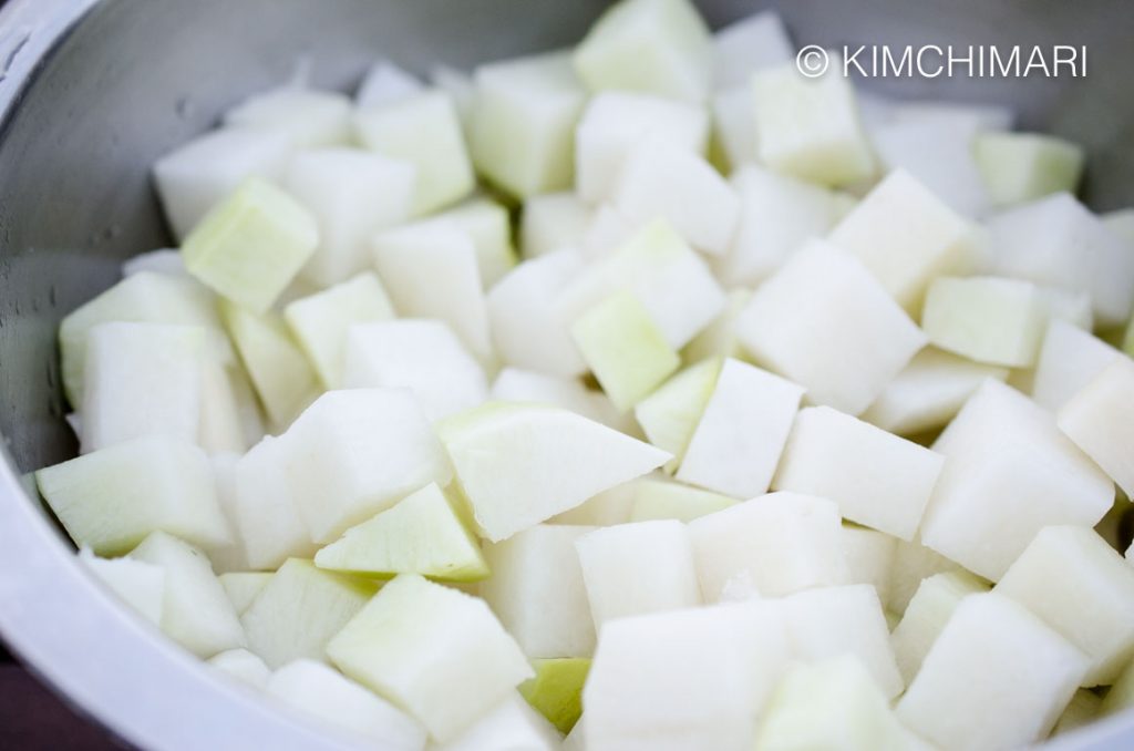 Kkakdugi radish cubes cut in bowl, before brine is added