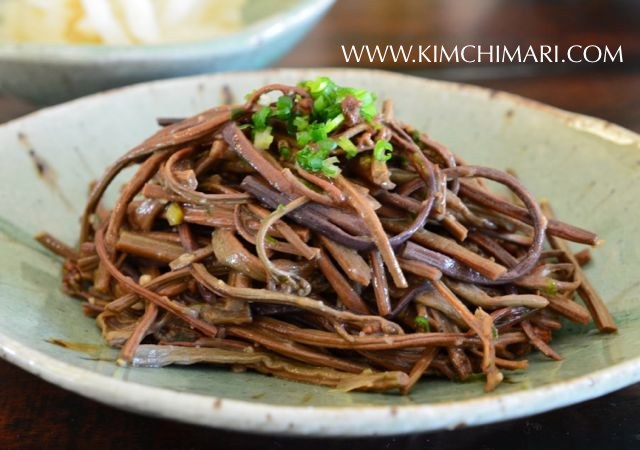 Korean Bracken Fiddlehead (Gosari) Namul in green plate