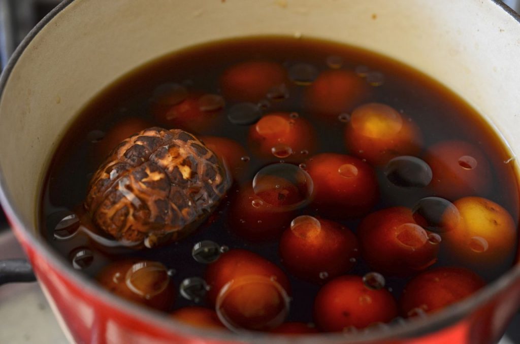 korean potato side dish (gamja jorim) cooking in pot