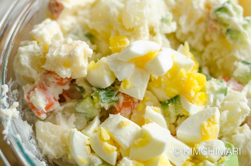 Korean potato salad mixed with eggs added on top