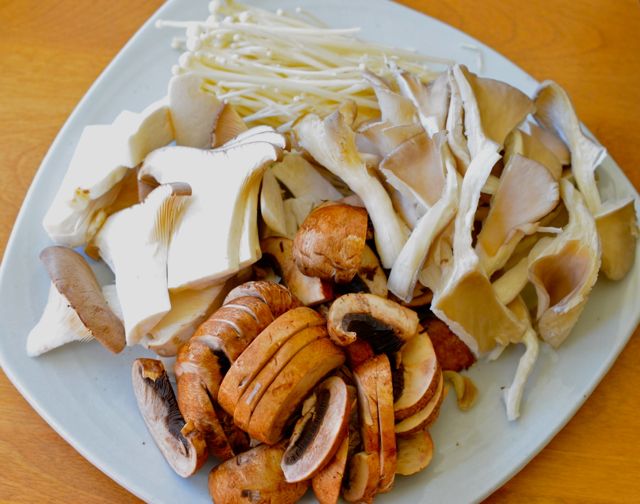 Enoki, Oyster, King Oyster, Brown mushrooms cut for Korean mushroom rice in Stone Pot