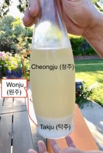 pic of bottled rice liquor - showing bottom layer of sediments and clearer liquid above