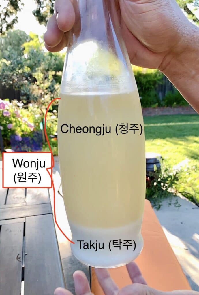 pic of bottled rice liquor - showing bottom layer of sediments and clearer liquid above