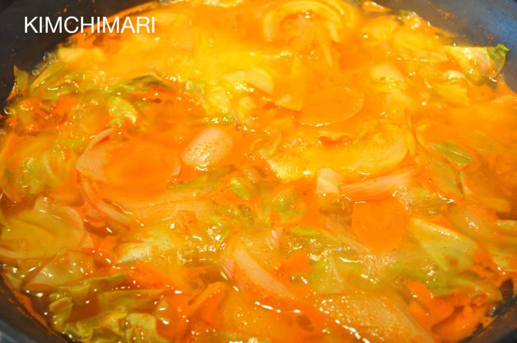 Spicy Rice Cake boiling with veggies