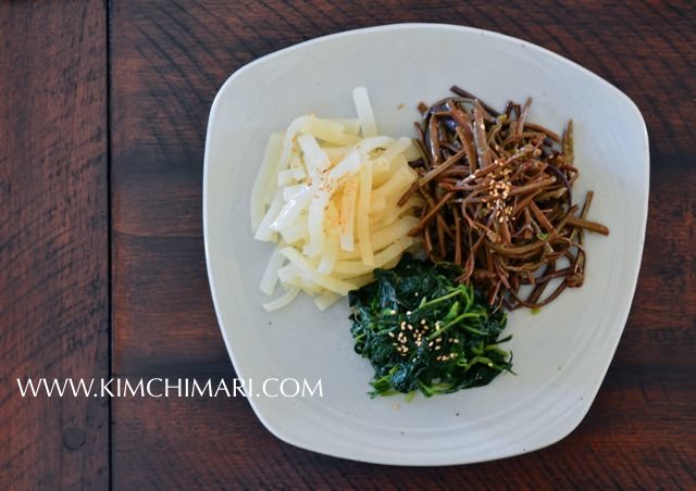 Plate of 3 different colors of vegetables - white, brown and green