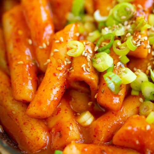 Tteokbokki closeup topped with green onions