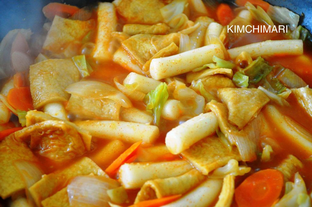 Tteokbokki - Korean spicy rice cake with vegetables, cooking in pan