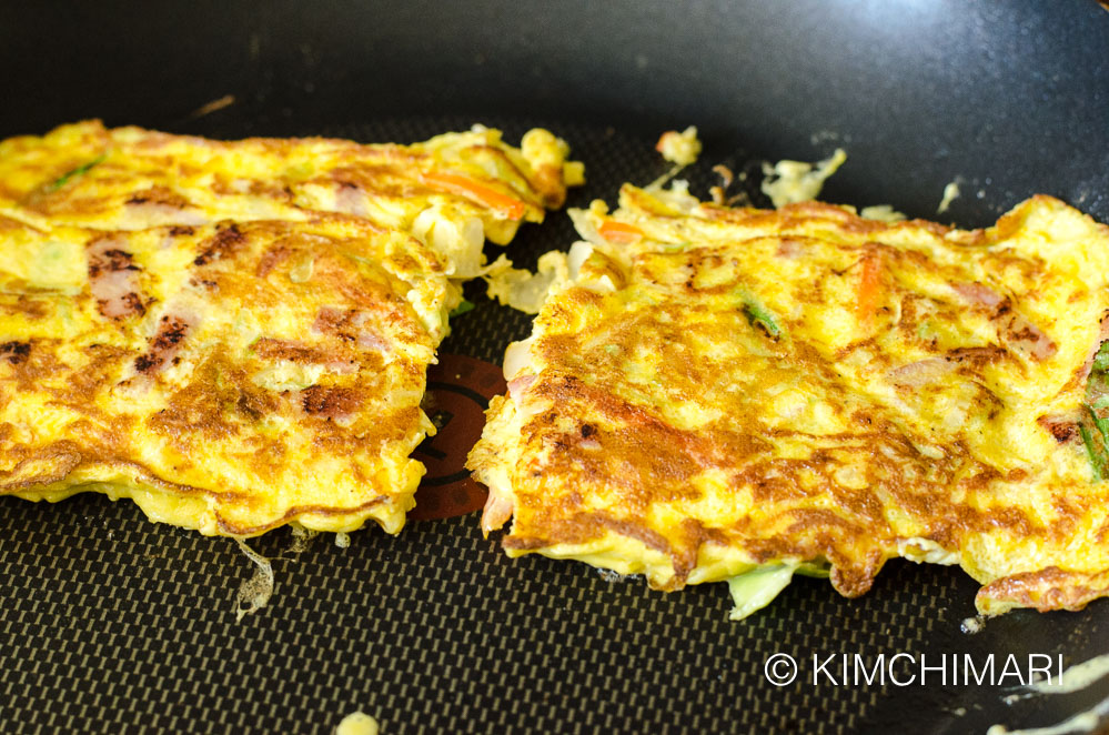 2 pieces of cooked egg omelette in non-stick frying pan